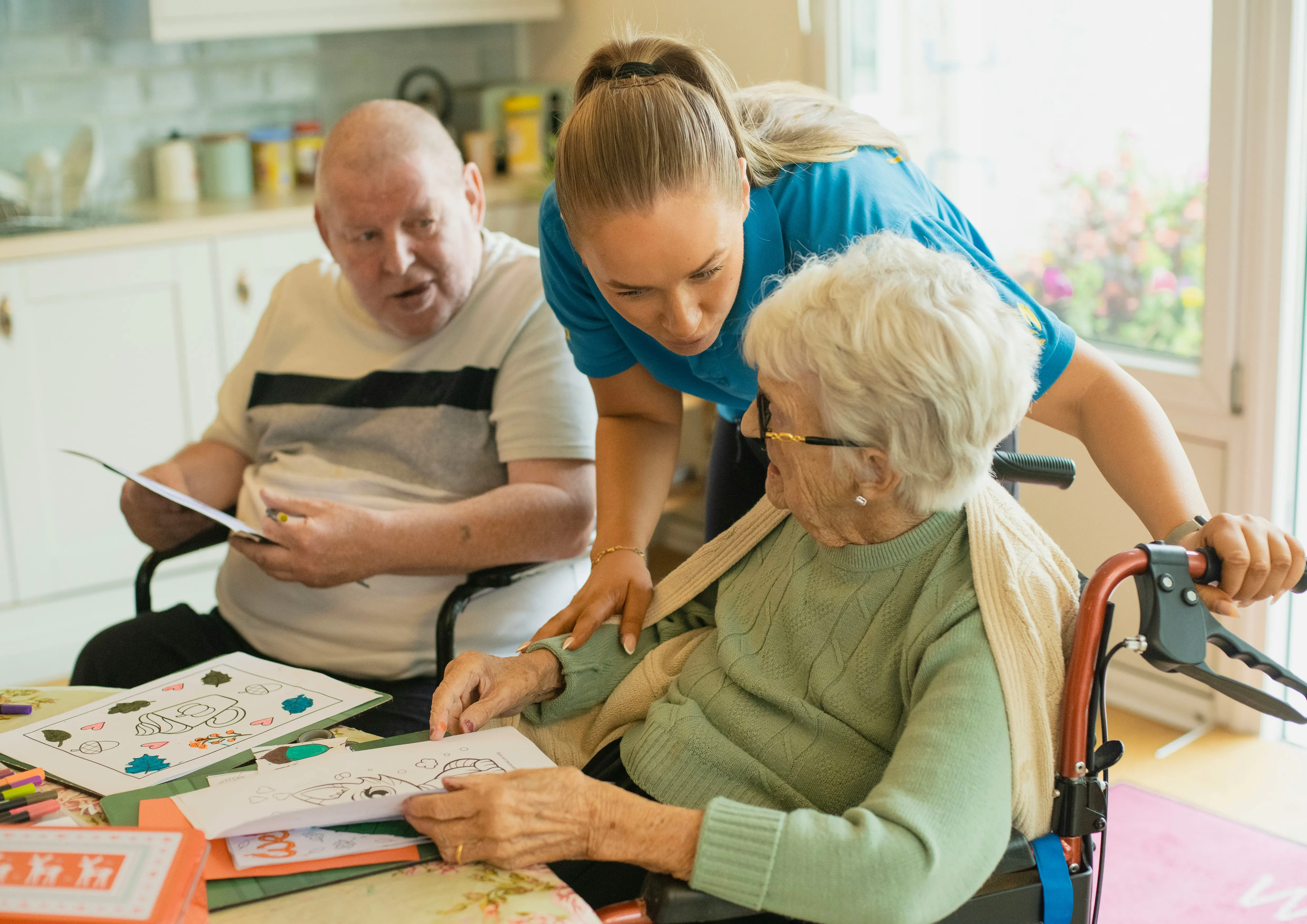 Caregiver with seniors doing activities